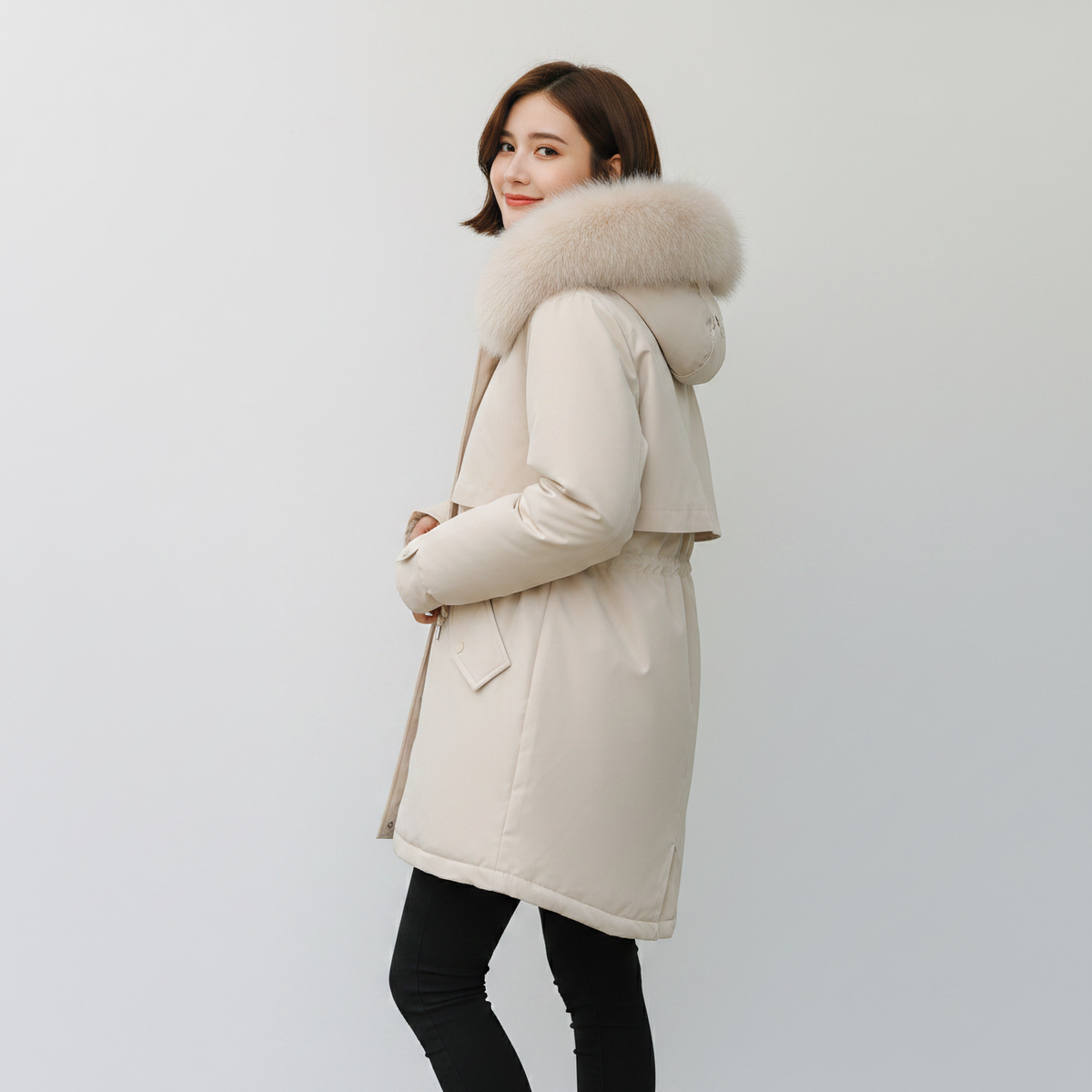 pikywiky white puffer jacket with a plush faux fur hood worn by a woman against a plain background