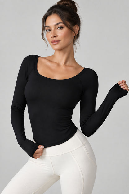 pikywiky women's black long sleeve athletic performance top with a scoop neckline and moisture-wicking fabric