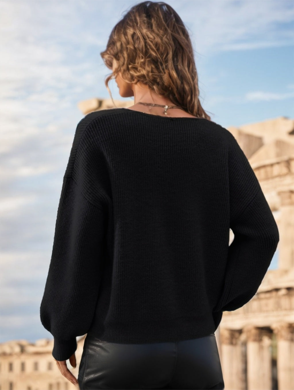 pikywiky black long sleeve ribbed knit sweater with a V-neckline worn by a woman outdoors