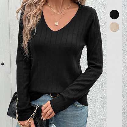 pikywiky black long sleeve V-neck sweater with ribbed sunken stripe texture worn with jeans and gold layered necklaces