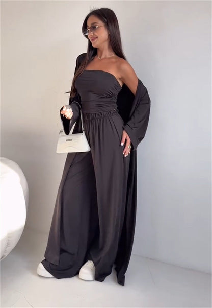 pikywiky three-piece lounge set featuring a black strapless tube top, wide-leg pants, and a matching long cardigan.