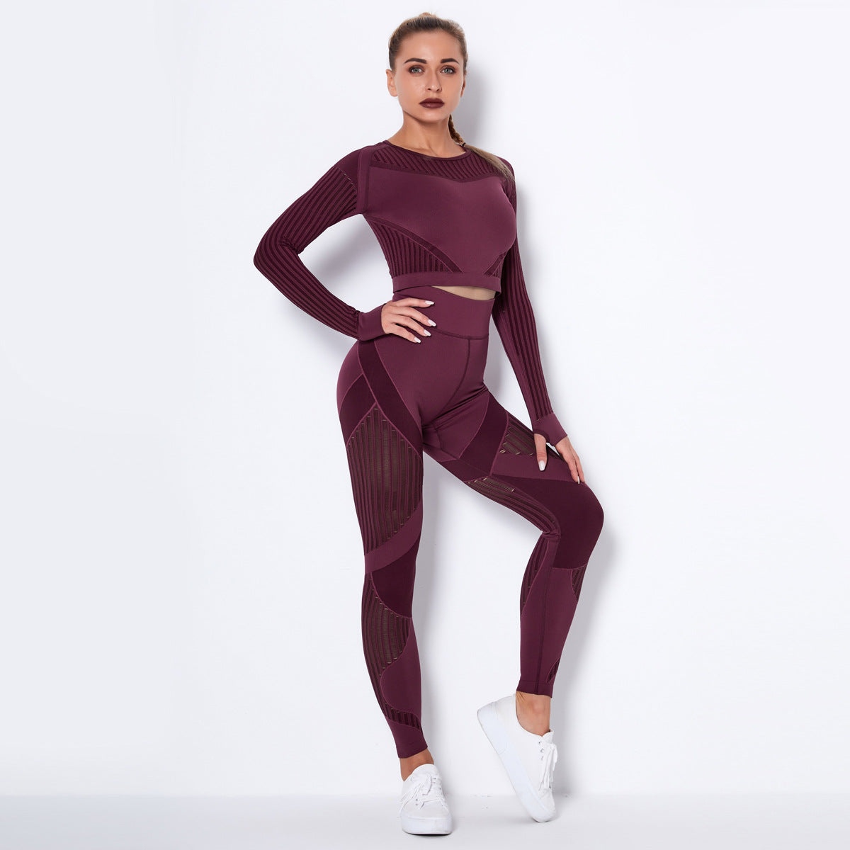 pikywiky seamless burgundy long sleeve crop top and high-waisted leggings set with mesh detailing on a female model