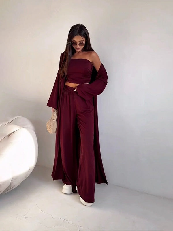 pikywiky burgundy three-piece lounge set with a strapless tube top, wide-leg pants, and a long matching cardigan.