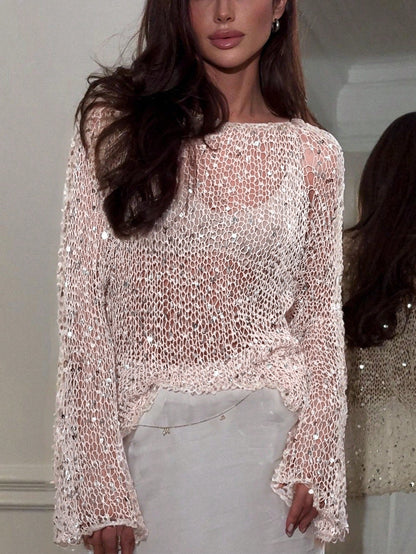 pikywiky open knit long sleeve sweater in cream with shimmering sequins worn by a woman