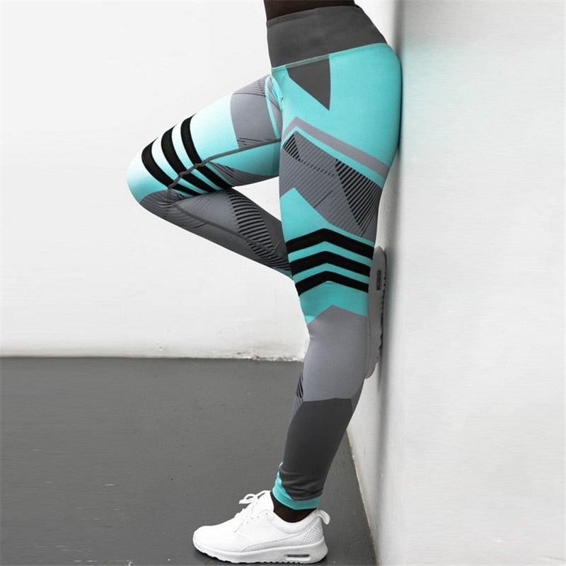 pikywiky high-waisted athletic leggings in teal and grey with geometric patterns and reflective details