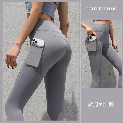 pikywiky high-waisted grey athletic leggings with side pockets for phone storage, featuring a seamless sculpting fit.