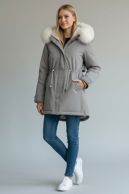 pikywiky grey puffer jacket with a plush faux fur hood, drawstring waist, and side pockets worn by a blonde model