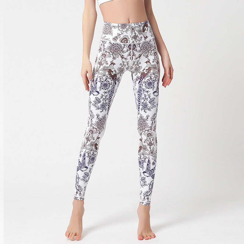 pikywiky high-waisted athletic leggings featuring a white base with intricate purple and brown floral bird print