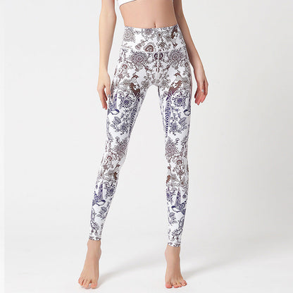 pikywiky high-waisted athletic leggings featuring a white base with intricate purple and brown floral bird print