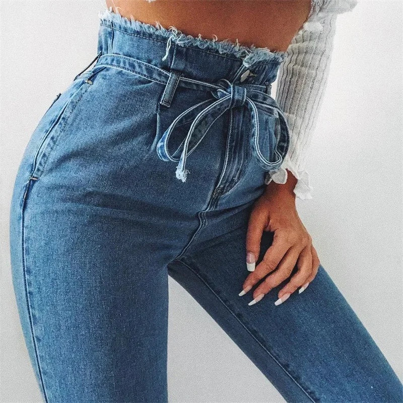 pikywiky high-waisted blue denim jeans with a paperbag waist, tie-belt, and raw frayed edge detail