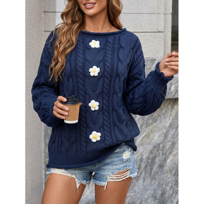 pikywiky navy blue cable knit sweater featuring white and yellow crochet flower appliqués and a relaxed fit