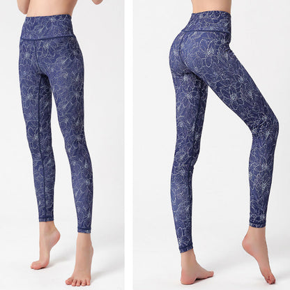 pikywiky high-waisted athletic leggings in navy blue with a white floral print, featuring moisture-wicking fabric.