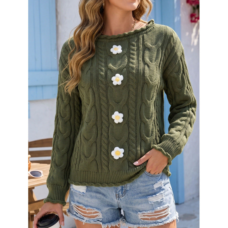 pikywiky olive green cable knit sweater with white crochet flower appliqués and ribbed trim worn with denim shorts