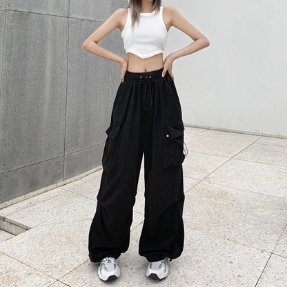 Pikywiky women's relaxed black cargo pants with side pockets in an urban setting
