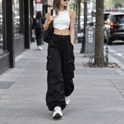 Woman wearing Pikywiky black cargo pants with drawstring, urban street style