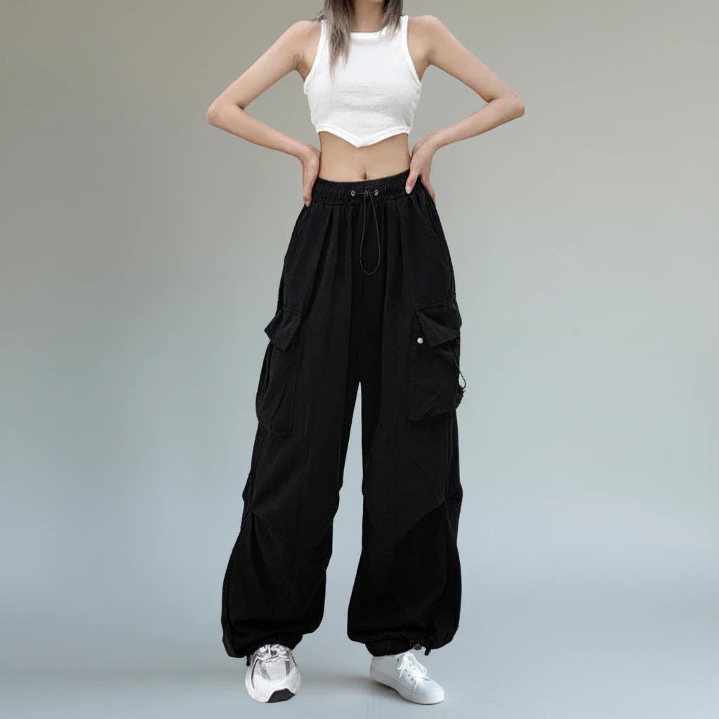 Pikywiky relaxed black cargo pants worn with a white tank top