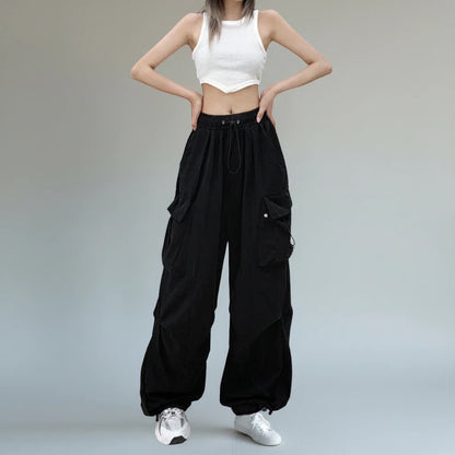 Pikywiky relaxed black cargo pants worn with a white tank top