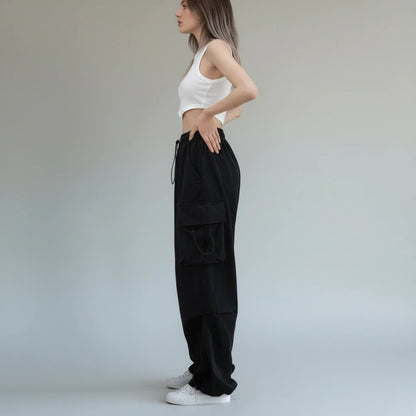 Pikywiky relaxed black cargo pants with drawstring cuffs, side view
