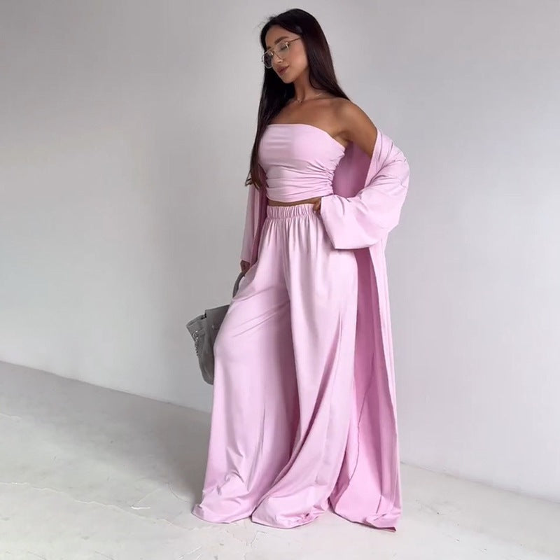 pikywiky light pink three-piece lounge set with a strapless tube top, wide-leg pants, and a matching long cardigan.