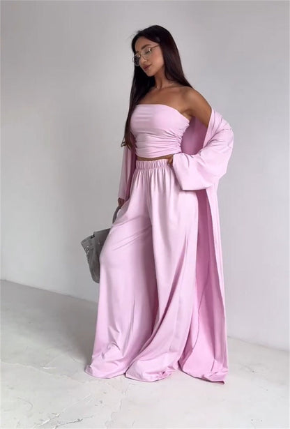 pikywiky three-piece light pink lounge set with a strapless tube top, wide-leg pants, and a matching long cardigan.