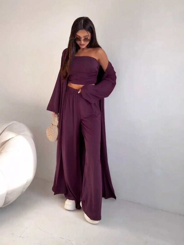 pikywiky dark purple three-piece lounge set featuring a tube top, wide-leg pants, and a long cardigan on a model.