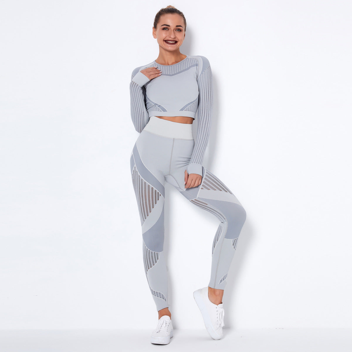 pikywiky light grey seamless long sleeve crop top and high-waisted leggings set with mesh detailing on a model