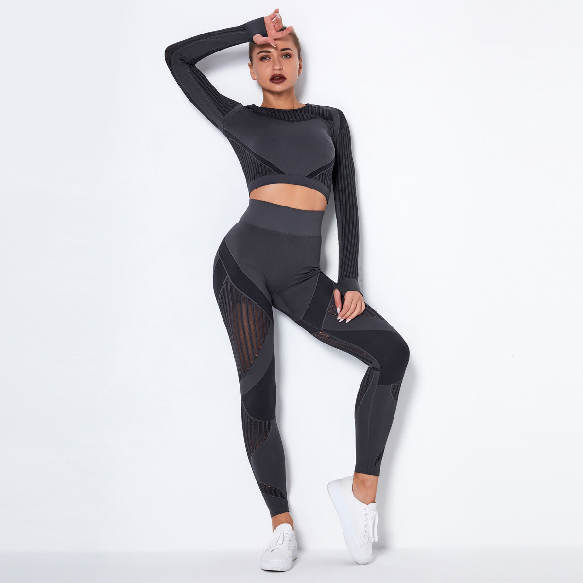 pikywiky dark grey seamless long sleeve crop top and high-waisted leggings set with mesh detailing on a female model