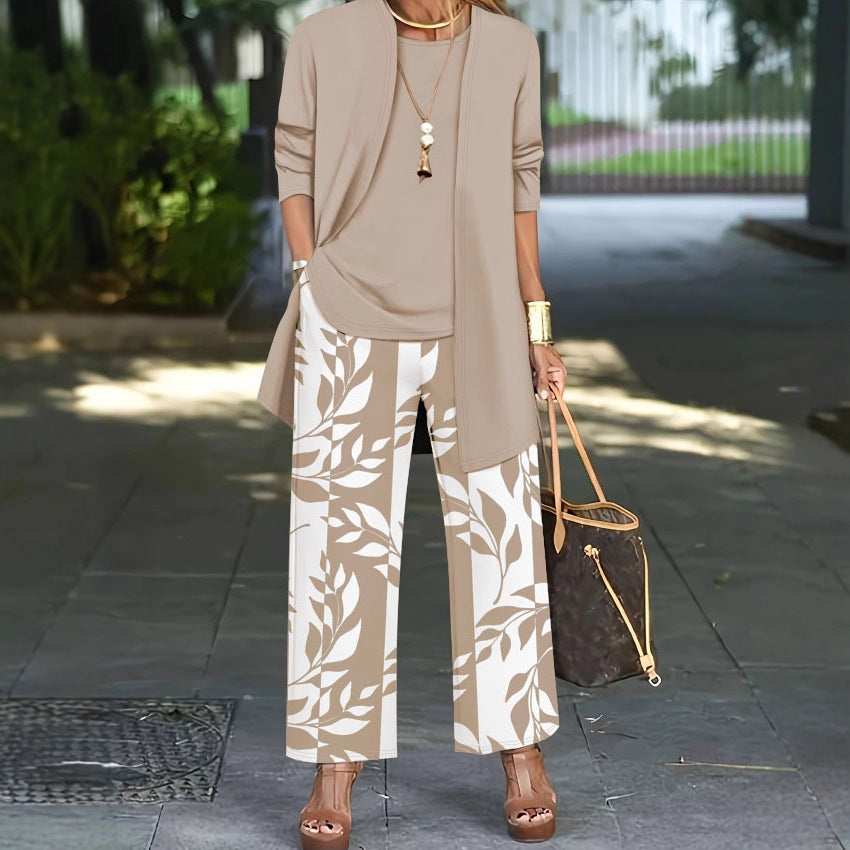 pikywiky three-piece casual outfit with a beige cardigan, sleeveless top, and wide-leg pants featuring a leaf print.