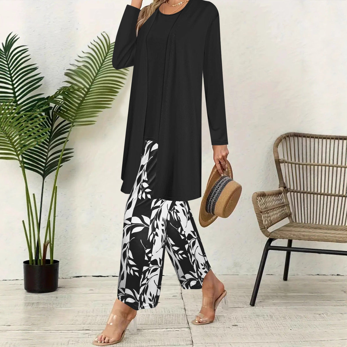 pikywiky three-piece outfit with black tank top, long cardigan, and wide-leg pants featuring a white leaf print.