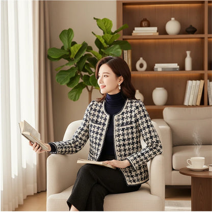 Woman seated wearing a Pikywiky navy houndstooth collarless jacket