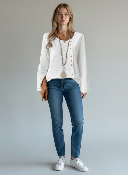 pikywiky white long sleeve pullover blouse with side button detail worn by a model with blue jeans and white sneakers