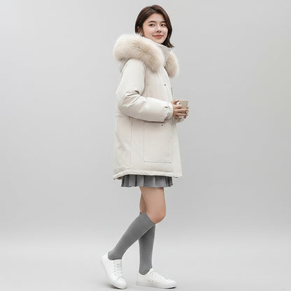 pikywiky white puffer jacket with faux fur hood worn by a woman with grey skirt and knee-high socks
