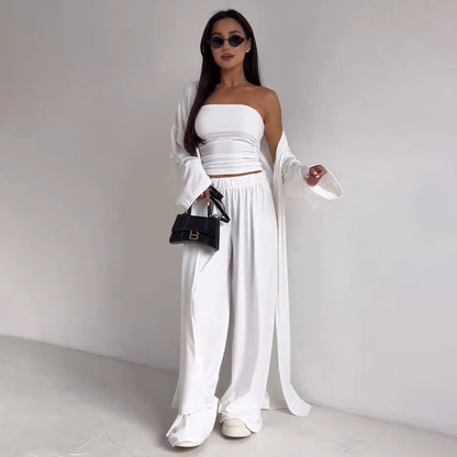 pikywiky white three-piece lounge set with a strapless tube top, wide-leg pants, and a matching long-sleeve cardigan.